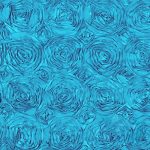 Beautiful turquoise rosette fabric – ideal for table overlays, event decor, and chair sashes.