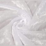 White crushed velvet tablecloth with a smooth, luxurious texture, ideal for sophisticated settings.