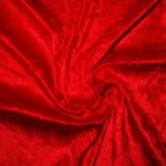 A rich red crushed velvet tablecloth, adding texture and elegance to wedding and banquet tables.